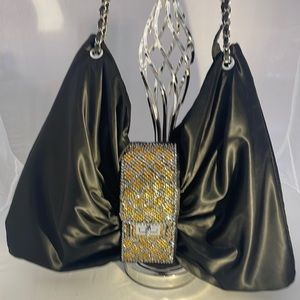 Black satin shoulder bag with gold and silver crystals.